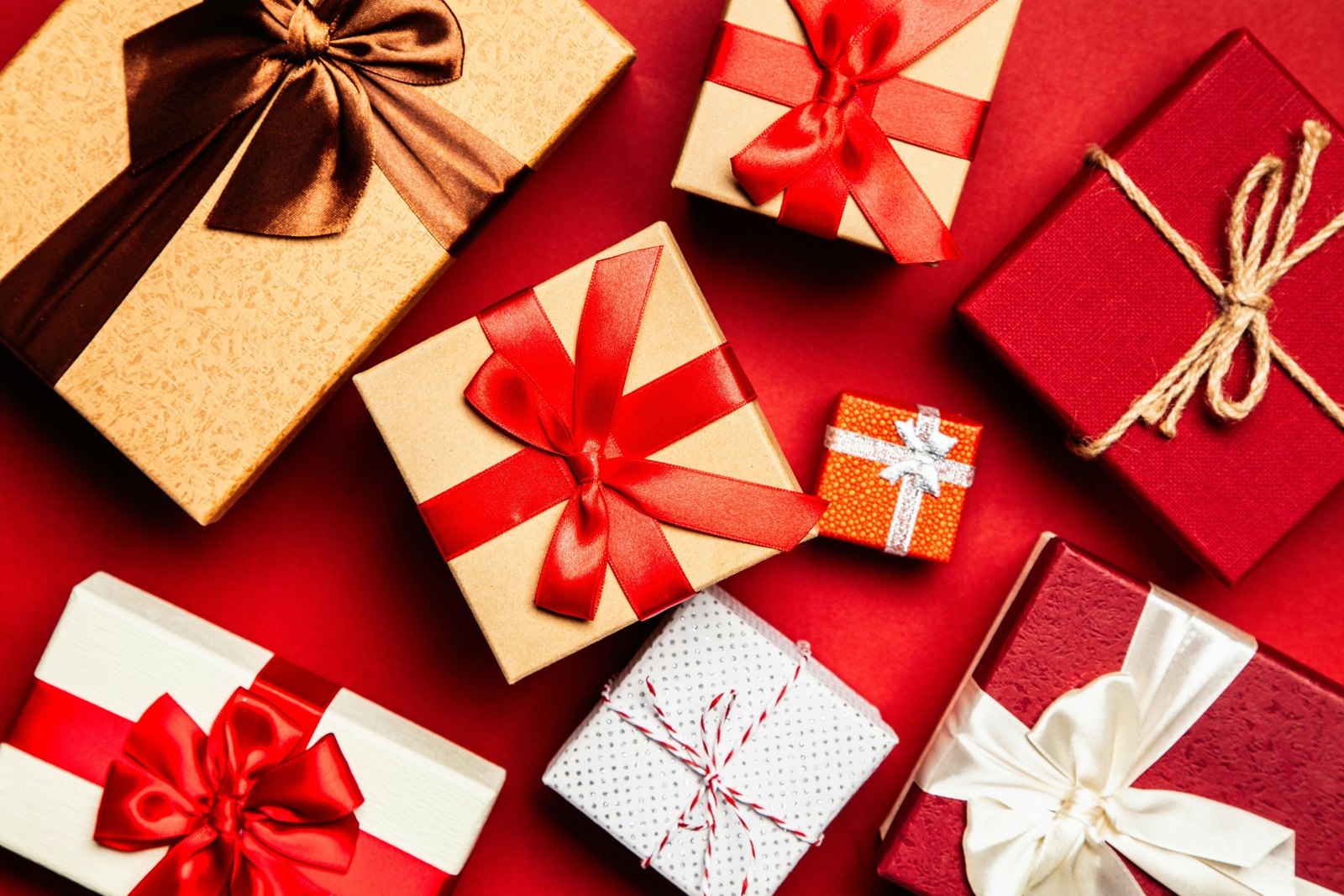 Wrapped gift boxes with red ribbons