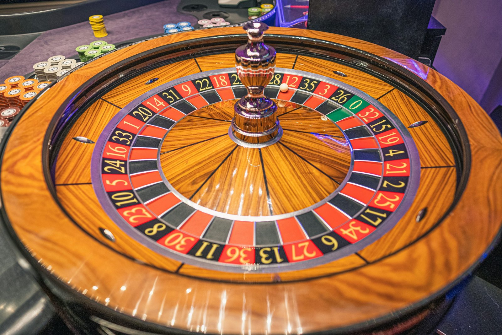 Roulette wheel and chips on a casino table