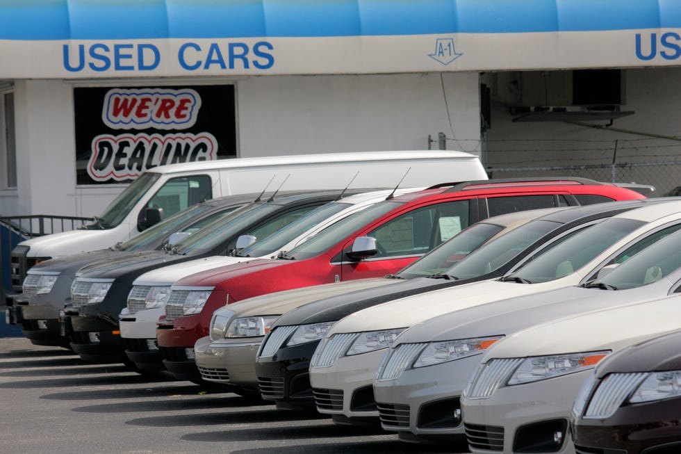 Used cars parked at a dealership