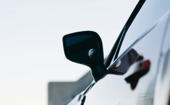 Car side mirror and silver bodywork