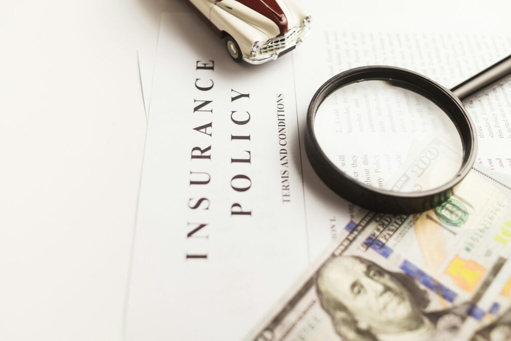 Magnifying glass over an insurance policy
