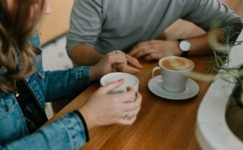 Two people sharing coffee at a table