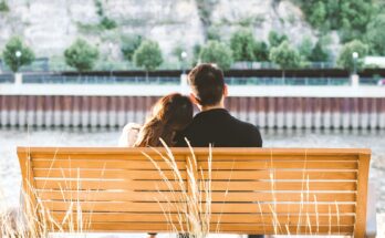 Couple sitting together on a park bench
