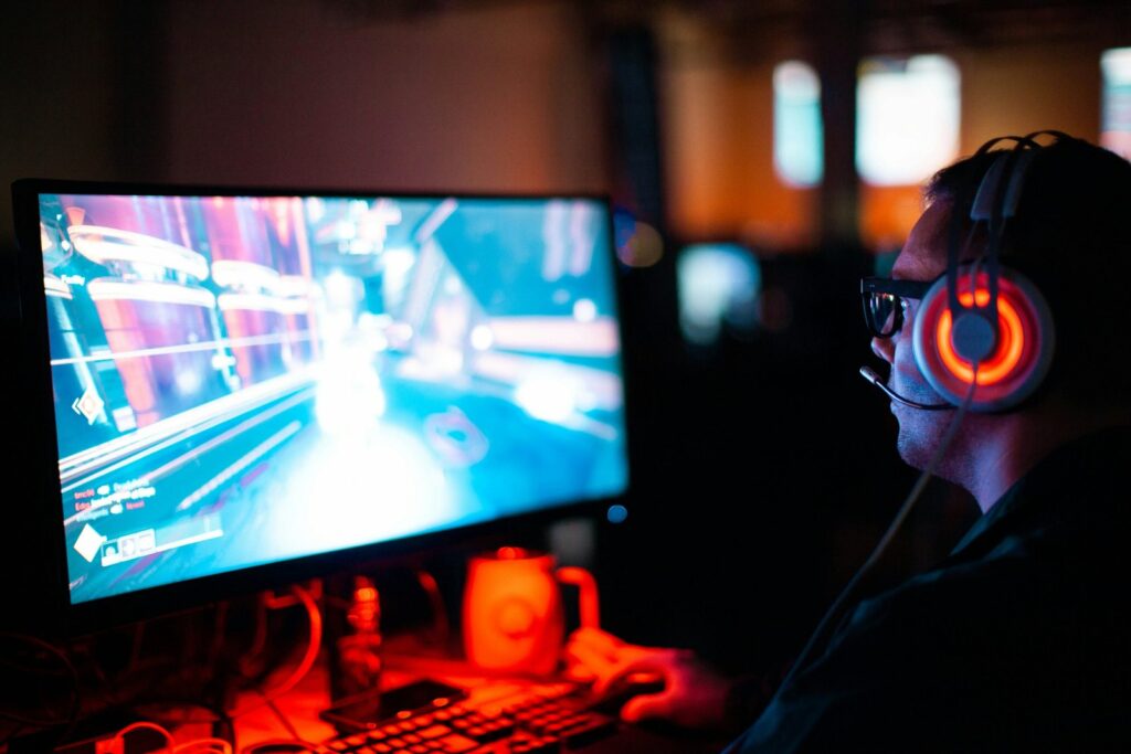 Gamer wearing a headset at a computer