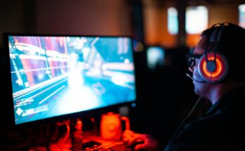 Gamer wearing a headset at a computer