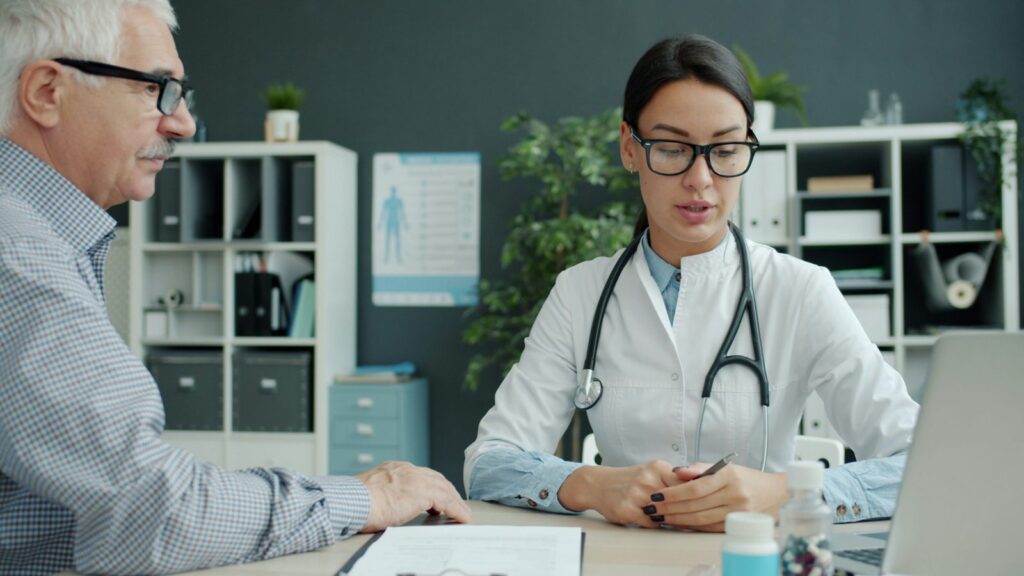 Patient and doctor discussing care in a clinic