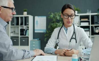 Patient and doctor discussing care in a clinic