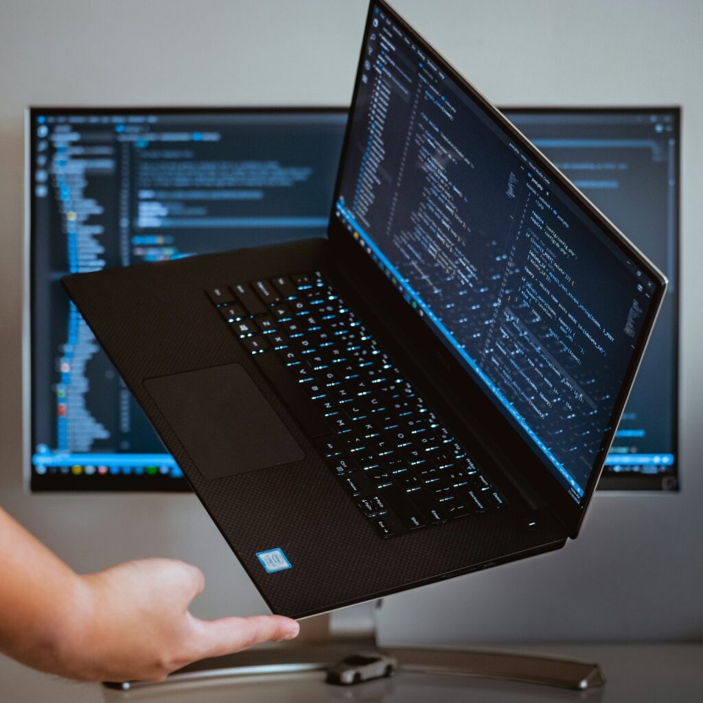 Laptop displaying programming code