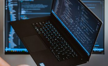 Laptop displaying programming code