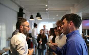 a group of people standing in a room