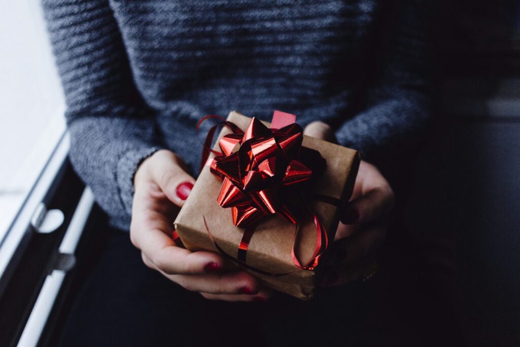 Person holding a wrapped gift