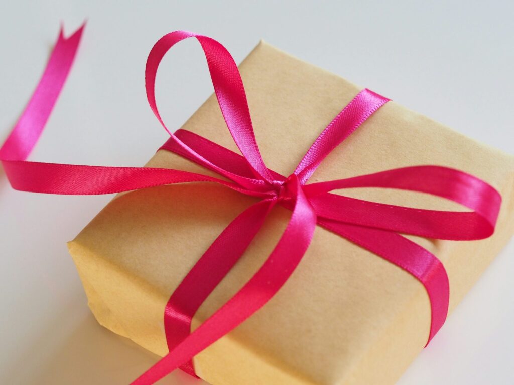 Gift box tied with a pink ribbon