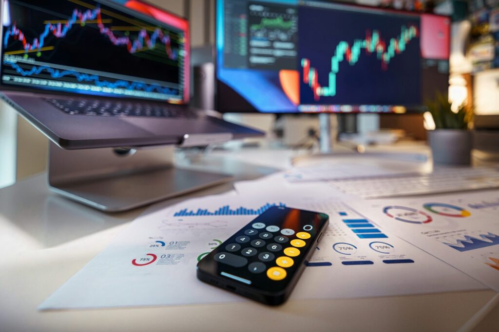 Calculator and charts at a financial workstation