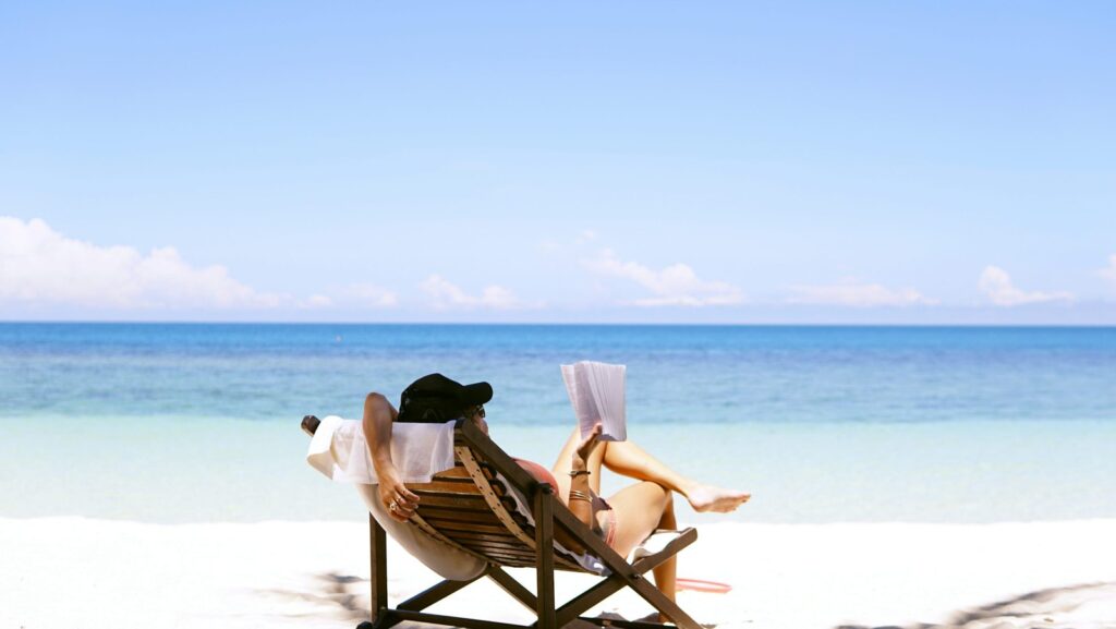 Traveler relaxing in a chair on a beach