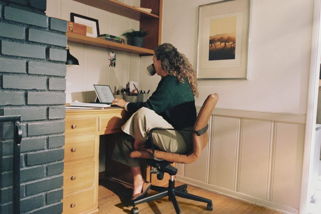 Woman working at a home office desk