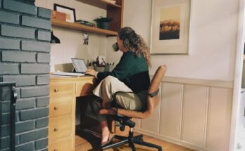 Woman working at a home office desk