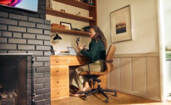 Woman working at a desk in a cozy home office